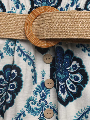 Close-up of a patterned shirt with a belt and buttons