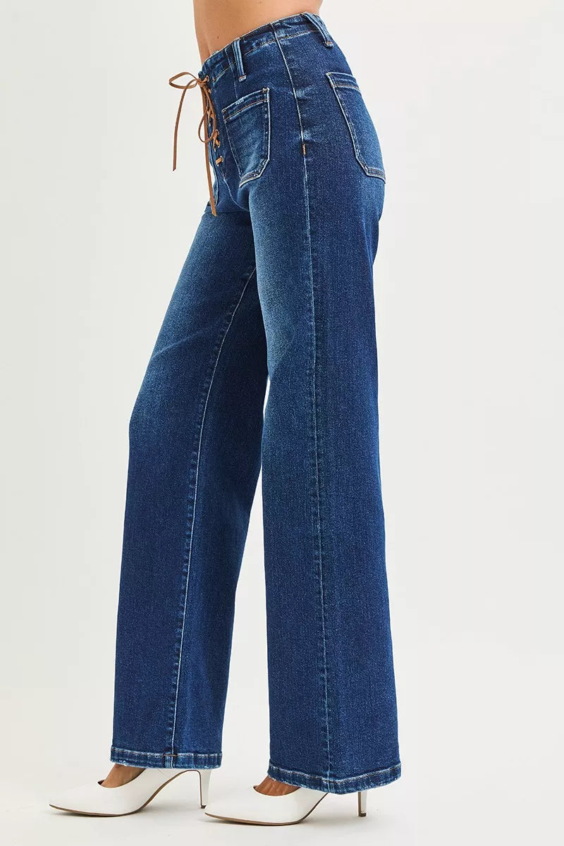 Blue jeans worn by a person on a white background