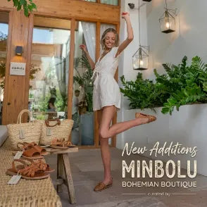 Woman in light beige v-neck romper smiling and kicking one foot up behind her to show off new shoes. original photo by simona-todorova-p2WLKciuJSQ-unsplash