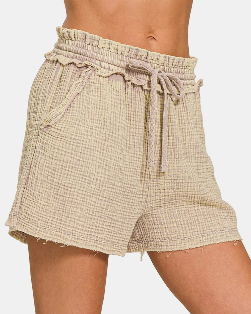 Beige checkered shorts with a drawstring waist on a white background