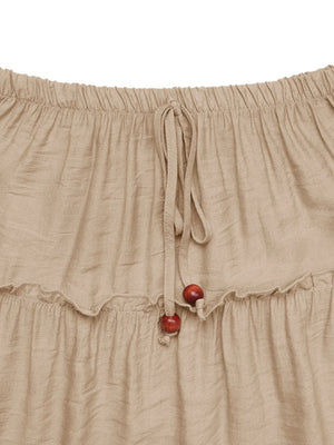 Beige skirt with red buttons on a white background