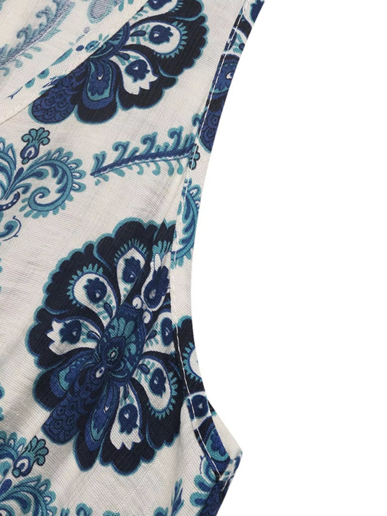 Close-up of a blue and white patterned fabric with 'Zara' branding.
