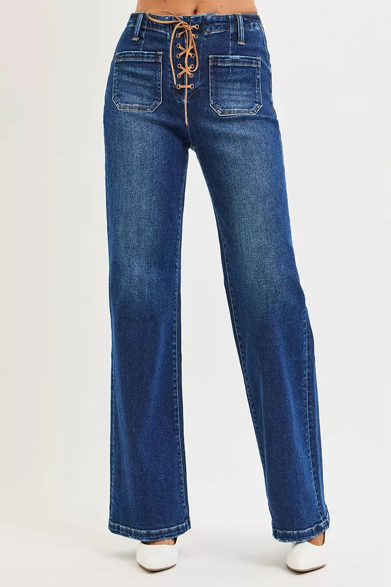 Blue jeans with lace-up front on a white background