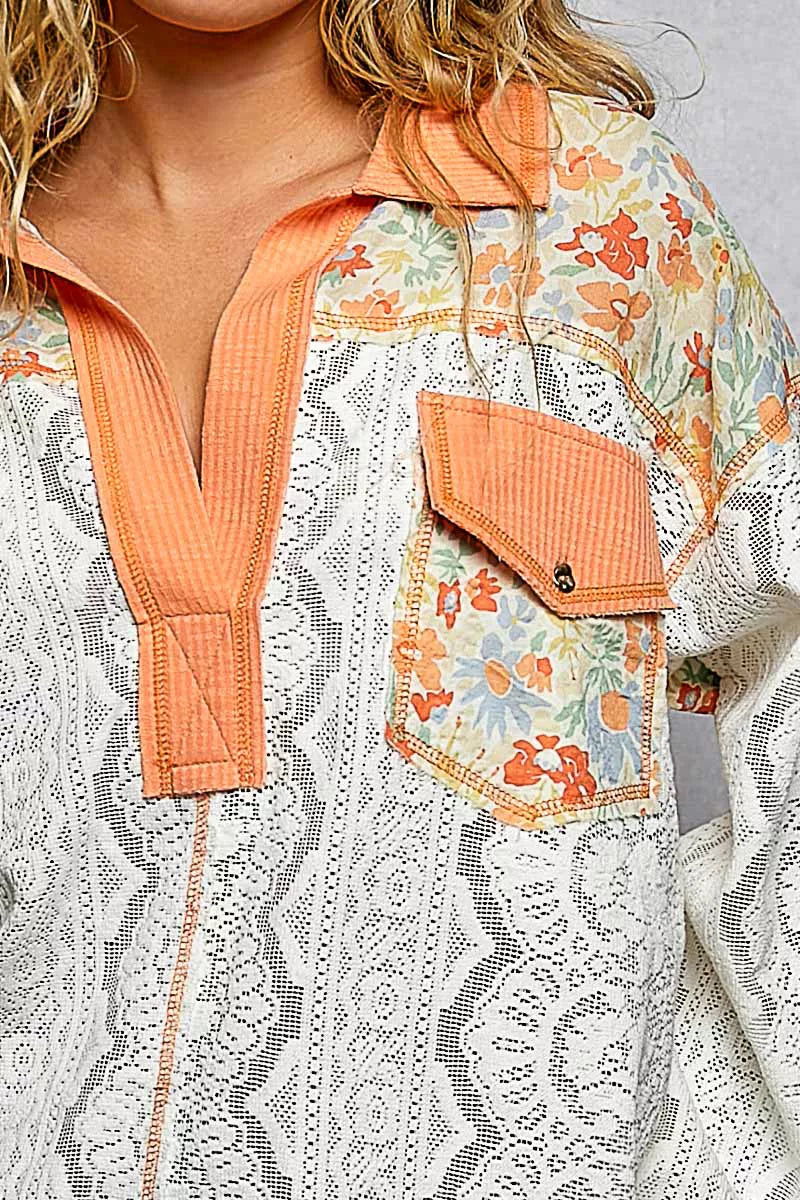 Floral patterned jacket with orange accents worn by a person