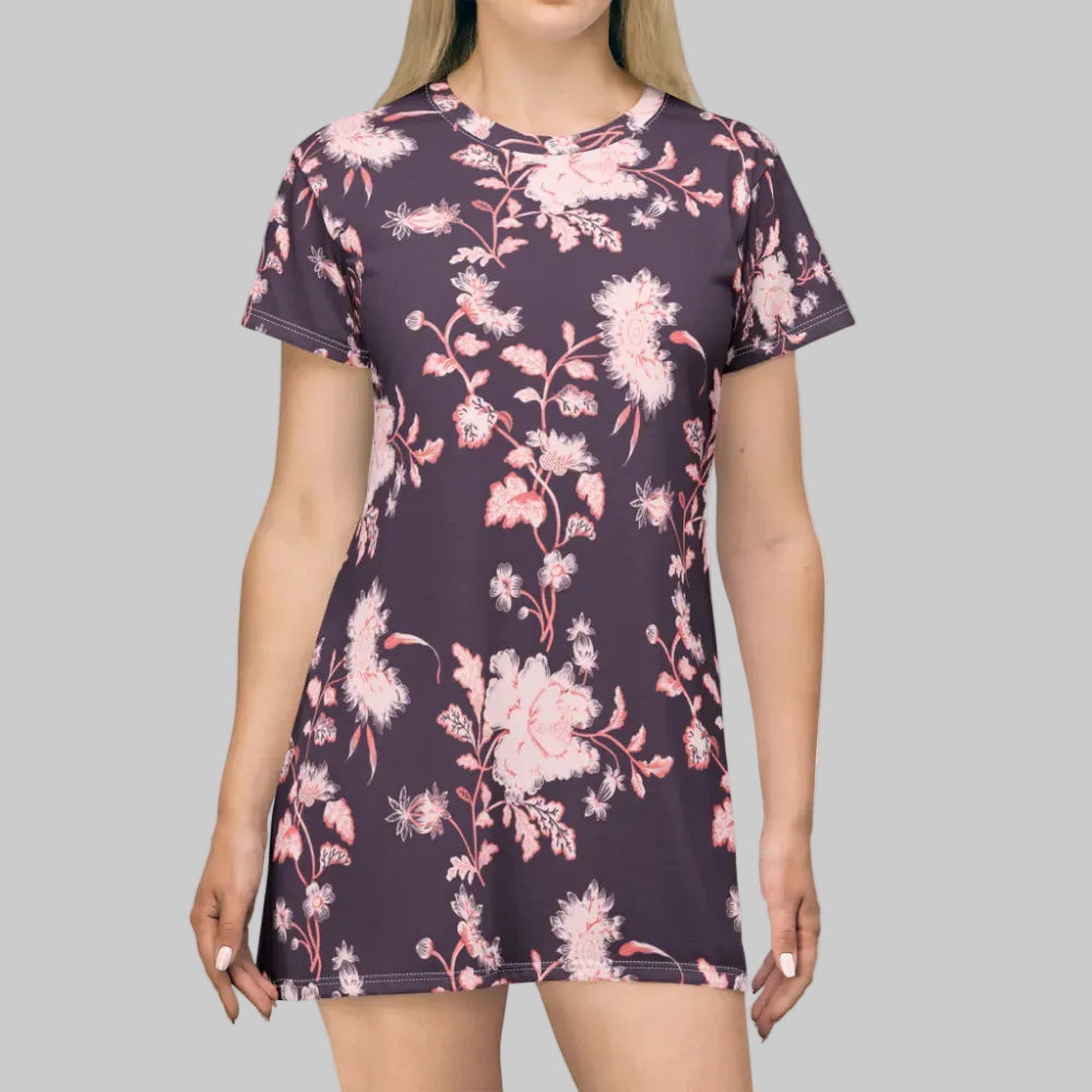 Woman wearing a floral dress with pink flowers on a white background